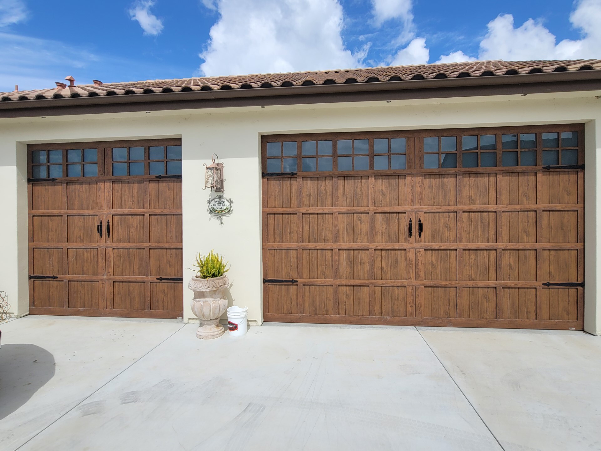 Custom wood carriage garage doors on a Central Coast home